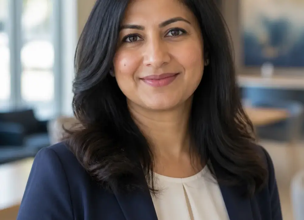 Fictional sample portrait for Amina Rahman.